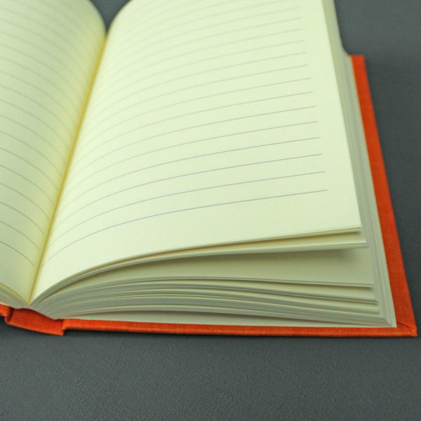 Orange liniertes DIN A6 Notizbuch