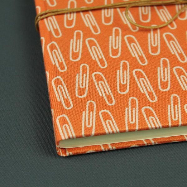Orange weißes Notizbuch