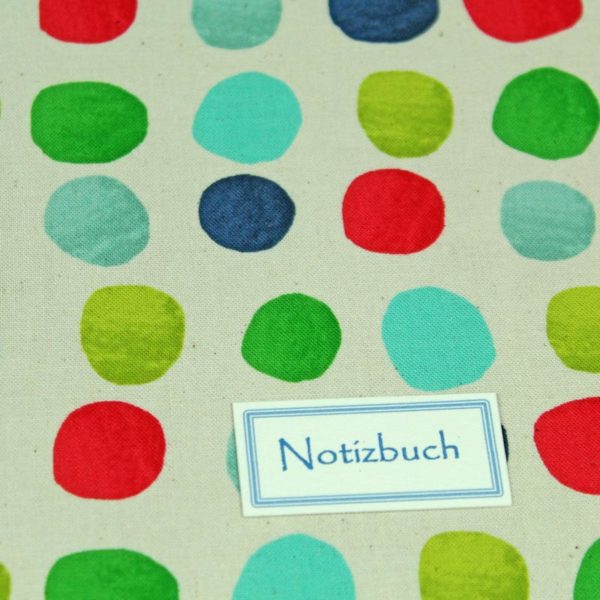 Cremefarbenes Notizbuch bunt gepunktet
