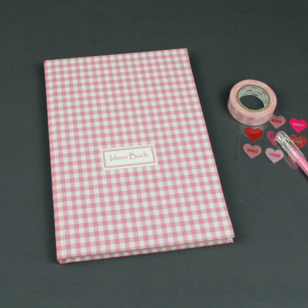 Rosa weiß kariertes Bullet Journal