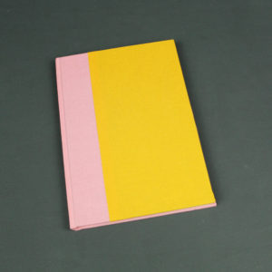 DIN A5 Notizbuch mit rosa und gelbem Buchbinderleinen